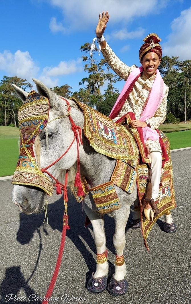 One of our grooms riding our white mare Joy during his baraat at TPC Sawgrass in Ponte Vedra Beach, FL.