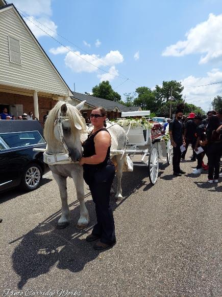 Family and friends getting to say their good byes to their loved one outside the church before their last ride to the cemetery in Jacksonville, FL begins.