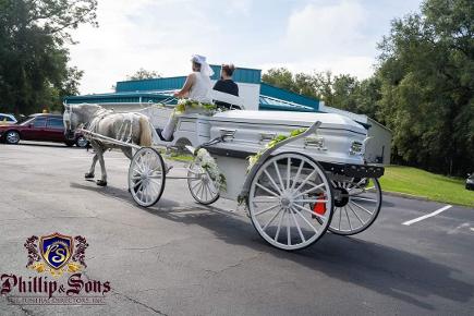 Pulling up to the church carrying this loved one on our white horse-drawn funeral caisson carriage for their memorial service in Gainesville, FL.